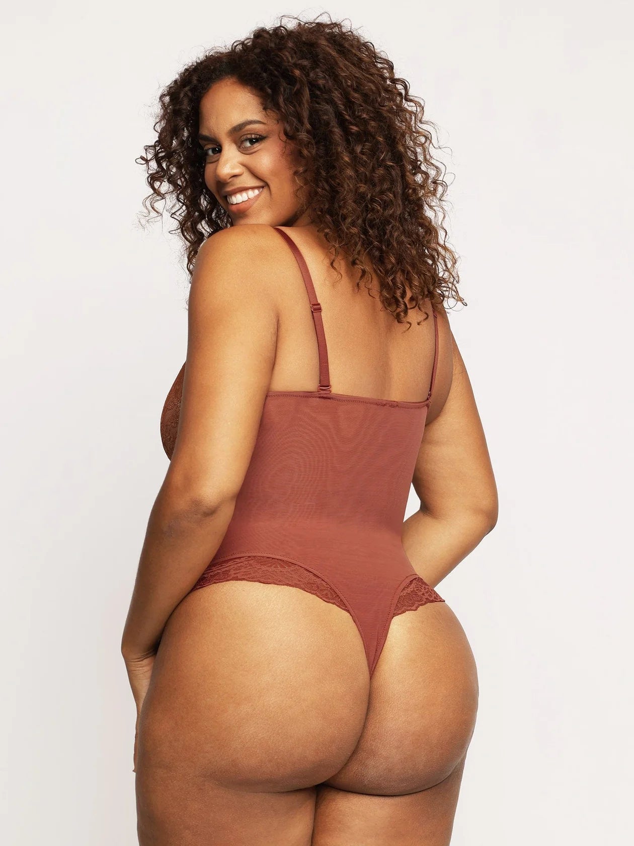 KANTEN BODYSUIT MET DIEPE V-HALS
